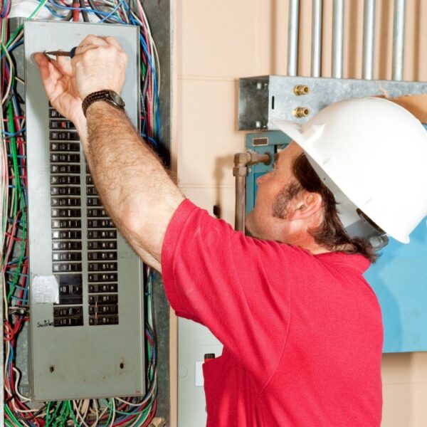 electrician working on electrical panel